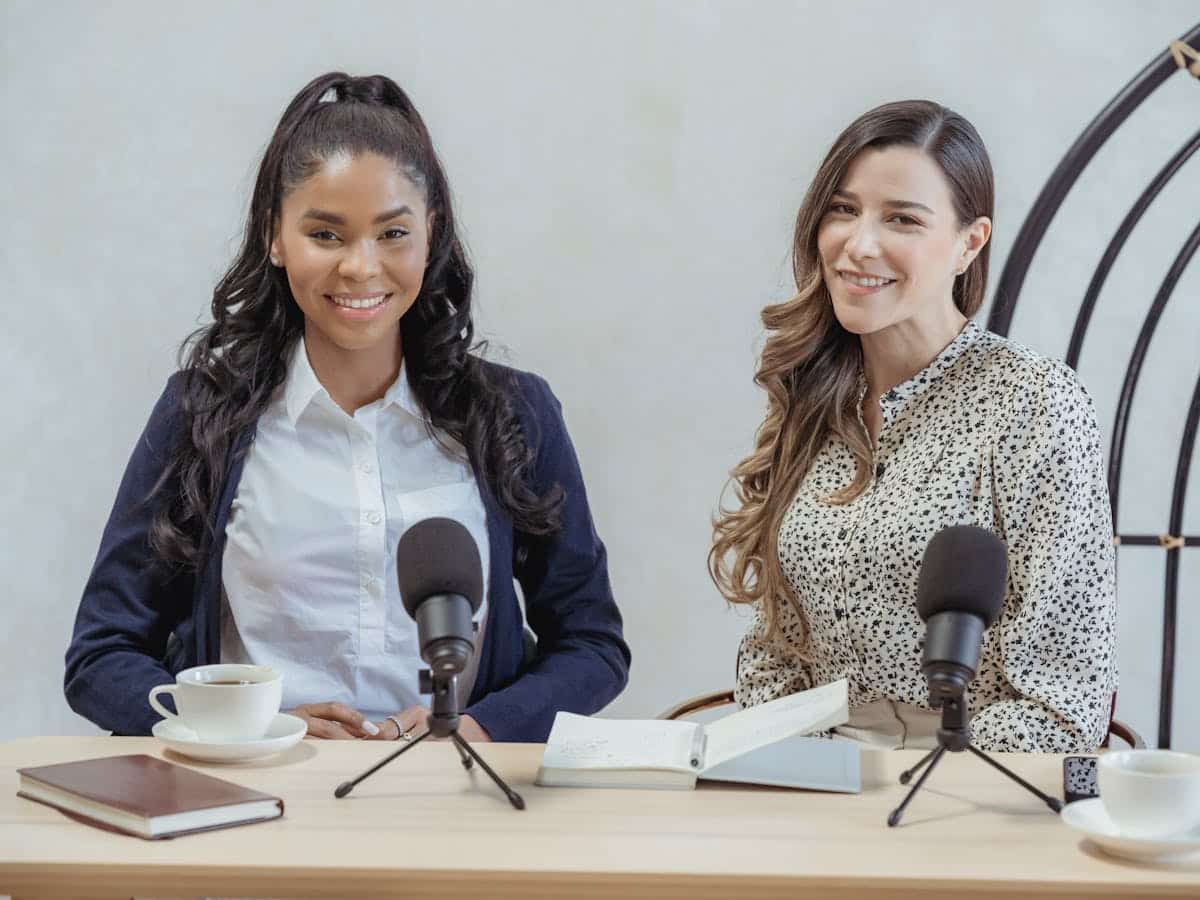 b2b influencers sit behind microphones ready to perform