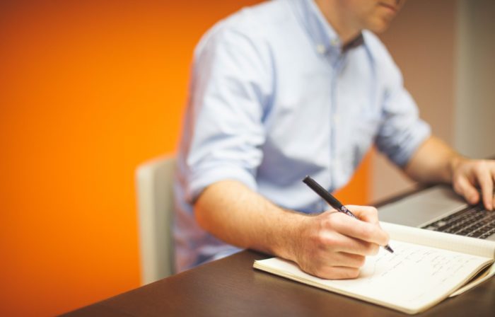 Man using a learning management system to watch training video