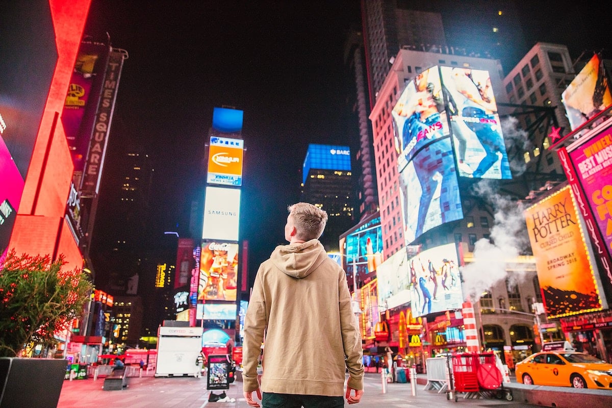 Young man seeing Times Square billboards