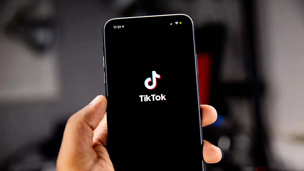 The TikTok logo on a mobile phone screen.